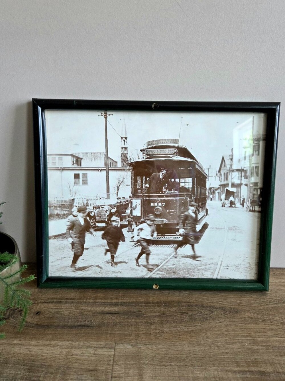 Vintage print picture of trolley of end of 19th century and running kids.